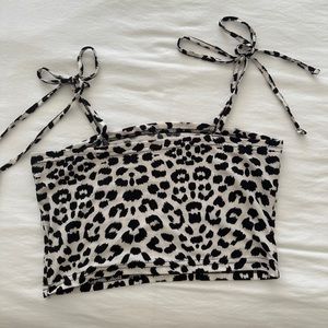 Cheetah crop top. Never worn! The straps tie into cute bows.